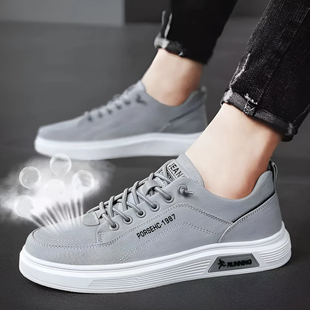 Men's grey canvas flats shoes with front lace-up stitching and shallow mouth design, side view