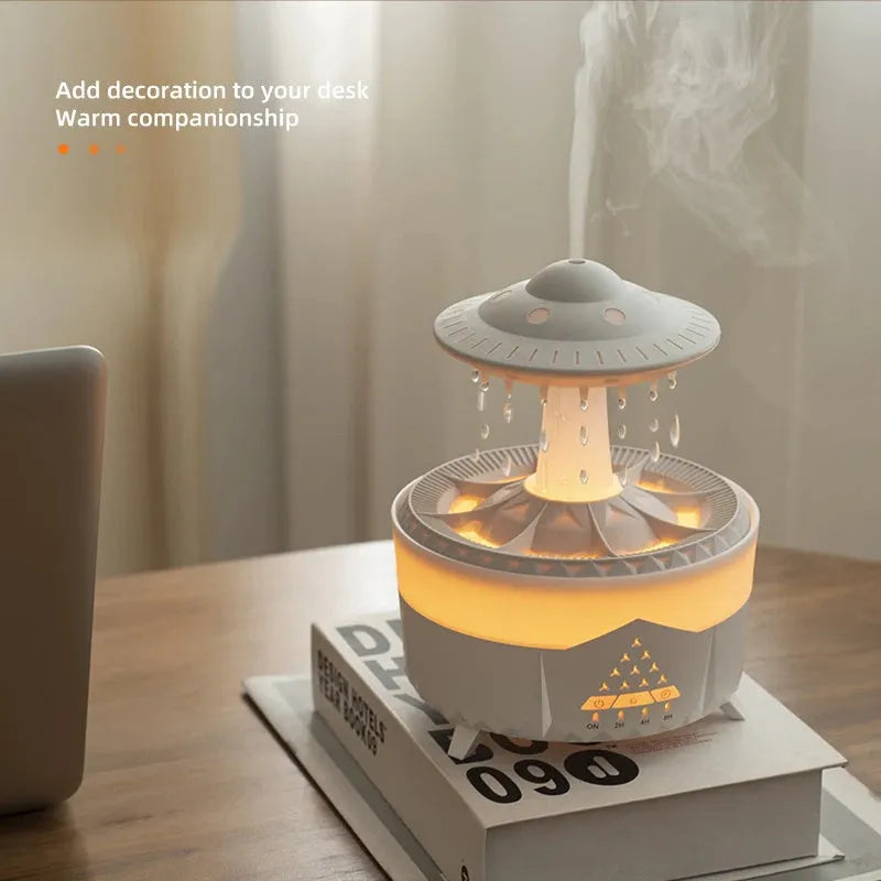 White UFO-shaped humidifier with water droplets creating mist and rain sounds