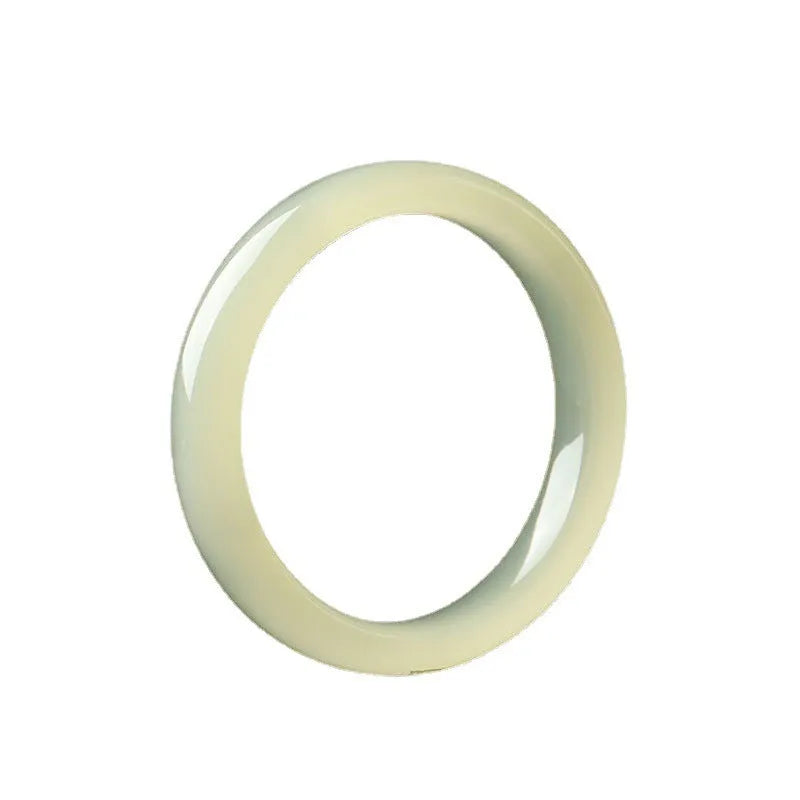 Round bar jade bracelet with winding silk texture showing circular geometry and polished surface