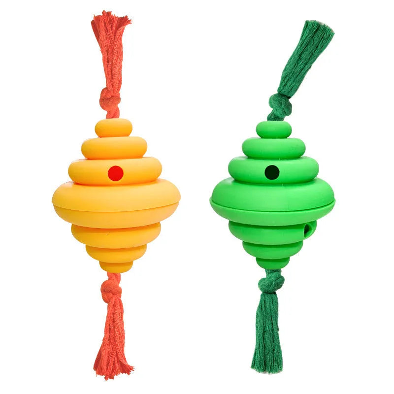Green and yellow silicone dog ball with rope attachment for food dispensing and tug-of-war games