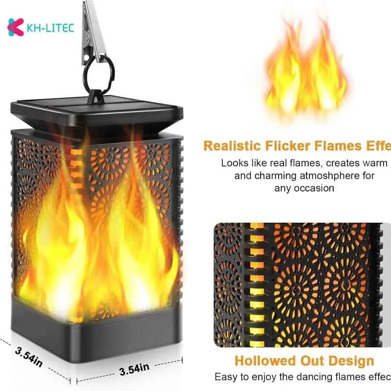 Set of four black solar-powered hanging torch lights with flickering flame LED effect in a garden setting