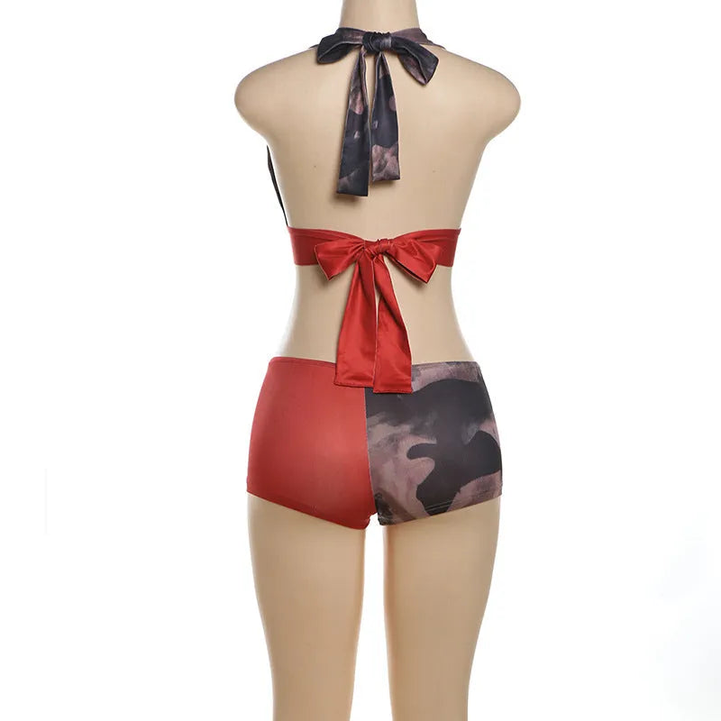 Red women's high waist hip lift shorts and bikini top set with 3D printed pattern.