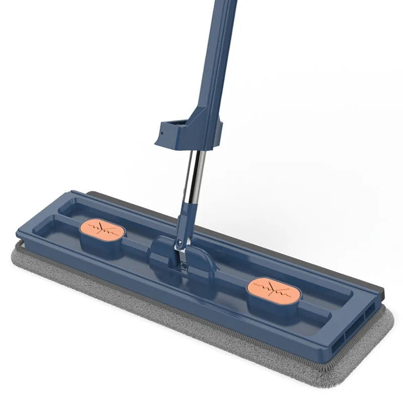 Large flat mop with long stainless steel handle and blue fine fibre mop cloth on a tiled floor
