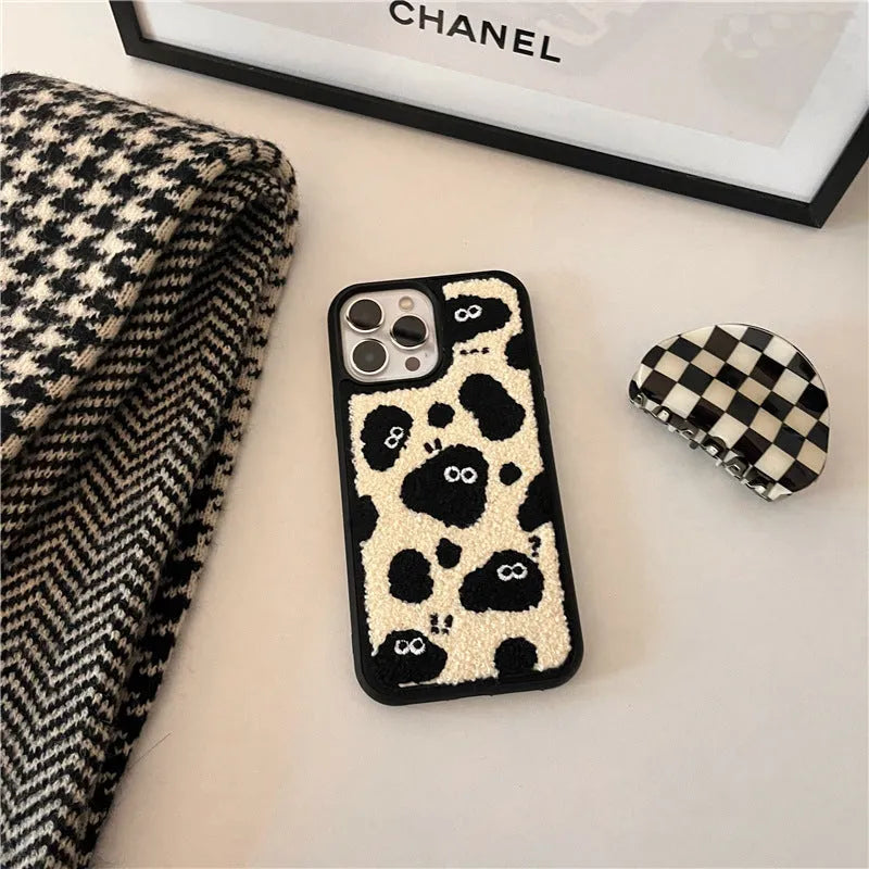 Black plush soft fairy design phone case for iPhone models.