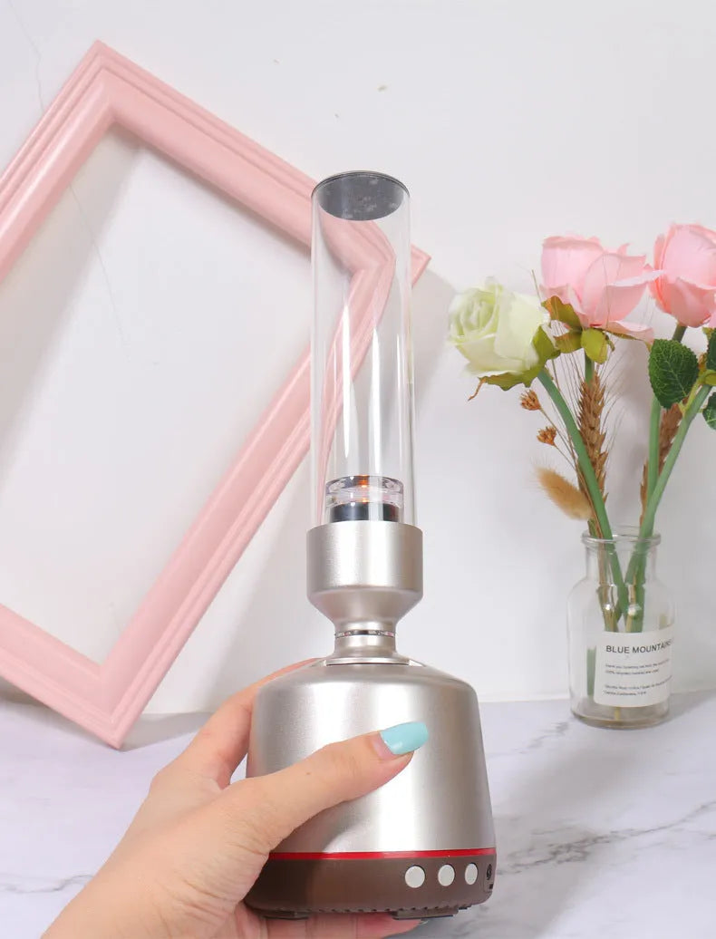 White silver Bluetooth speaker with integrated candlelight atmosphere night light.