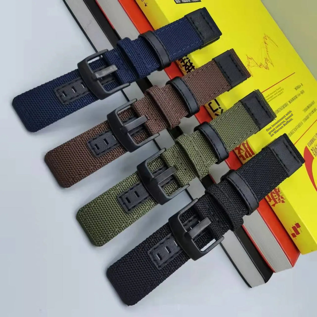 Canvas Oxford cloth watch strap in Army Green, showing textured fabric and metal buckle.