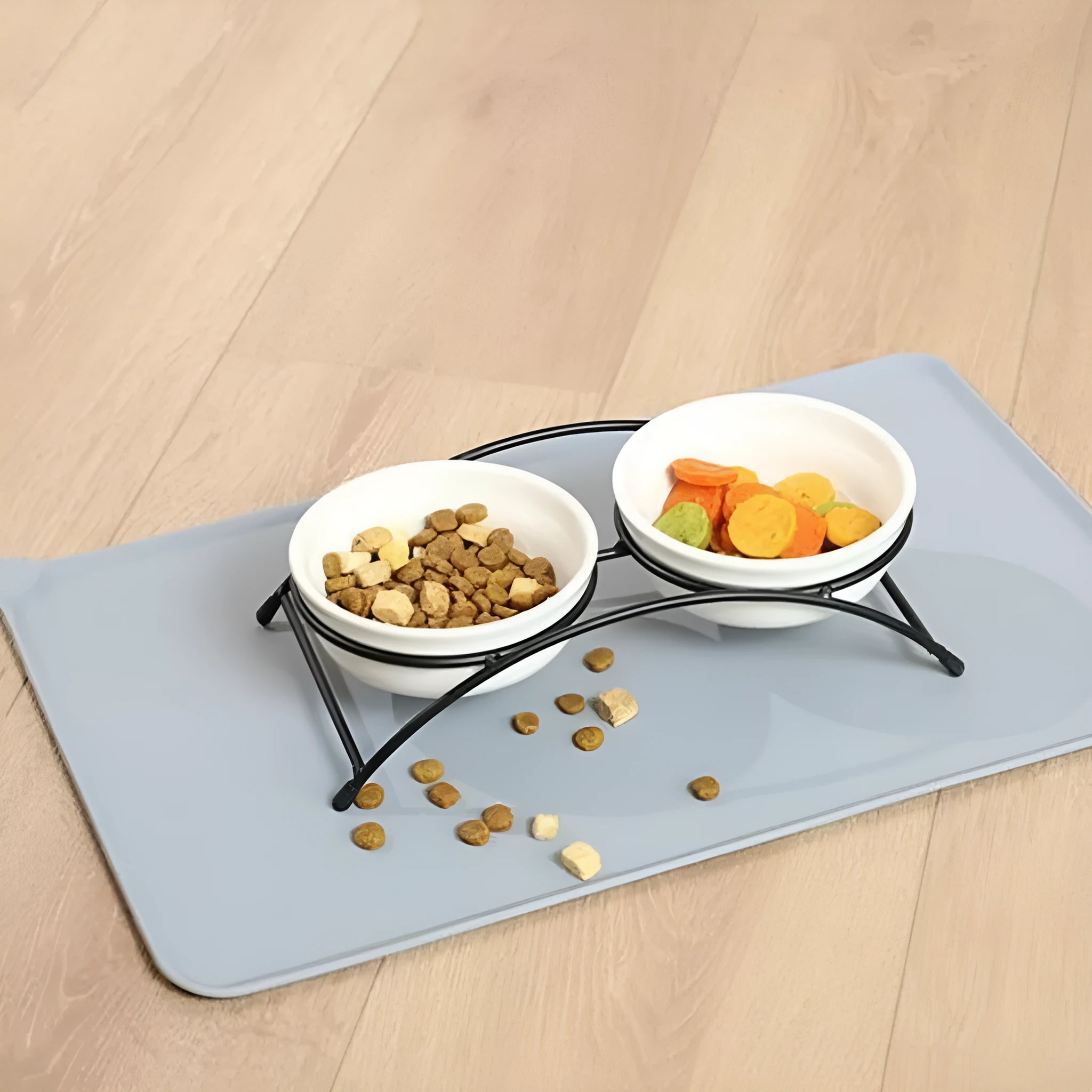 Silicone pet placemat under a dog bowl in grey colour on a kitchen floor.