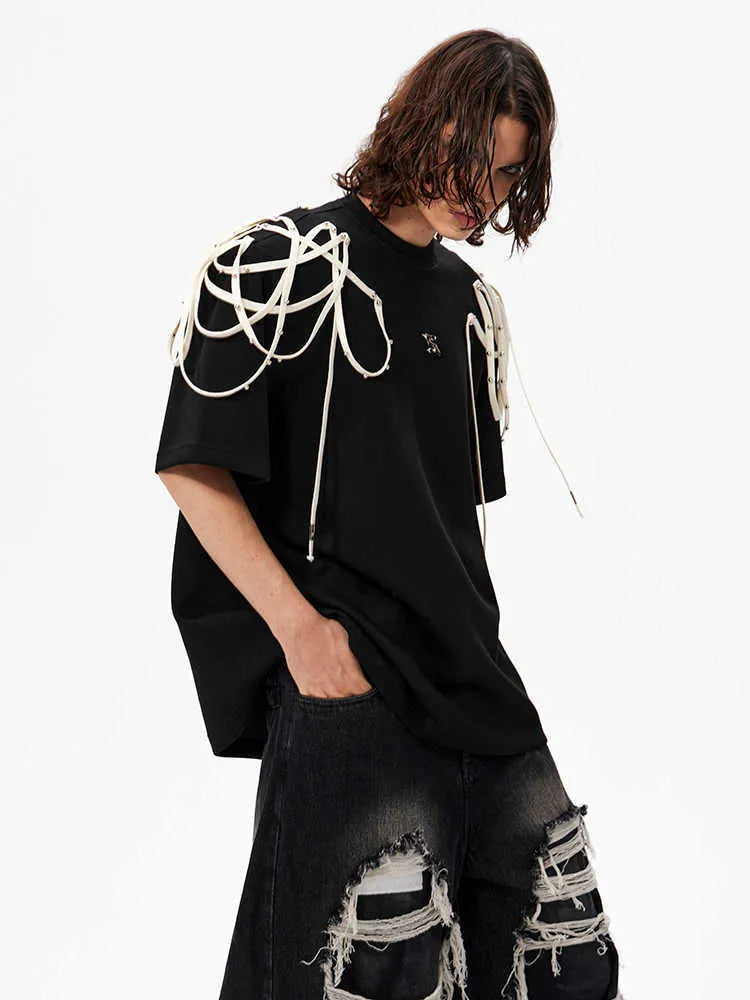 Black loose fit short-sleeved T-shirt with padded shoulders and rivet ribbon trim.