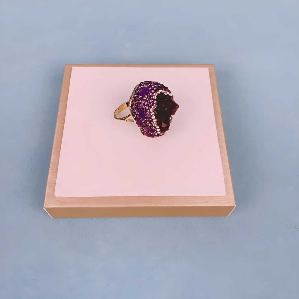 Natural Uruguay amethyst open adjustable ring on a white background showing the gemstone and open band design