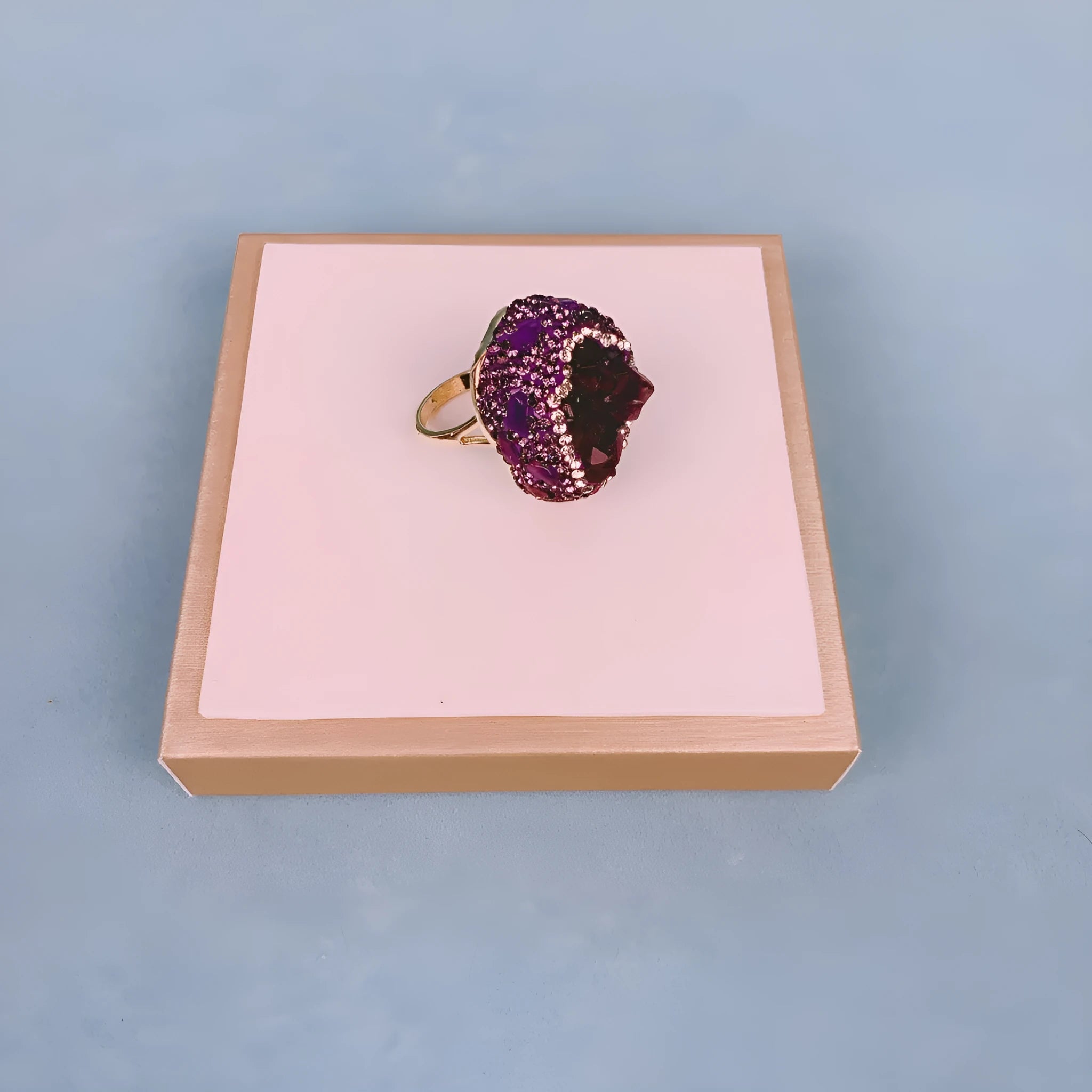 Natural Uruguay amethyst open adjustable ring on a white background showing the gemstone and open band design