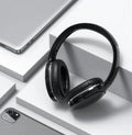 Black and white wireless Bluetooth sports headset with head-mounted design showing ear cups and headband