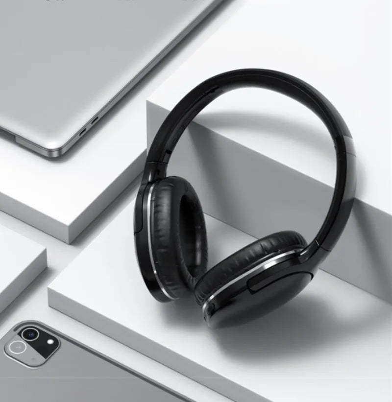 Black and white wireless Bluetooth sports headset with head-mounted design showing ear cups and headband