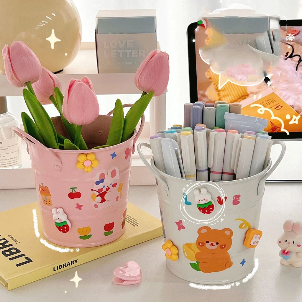 Round metal desk pen holder with iron art design in various colour options including pink, green, red, white and yellow