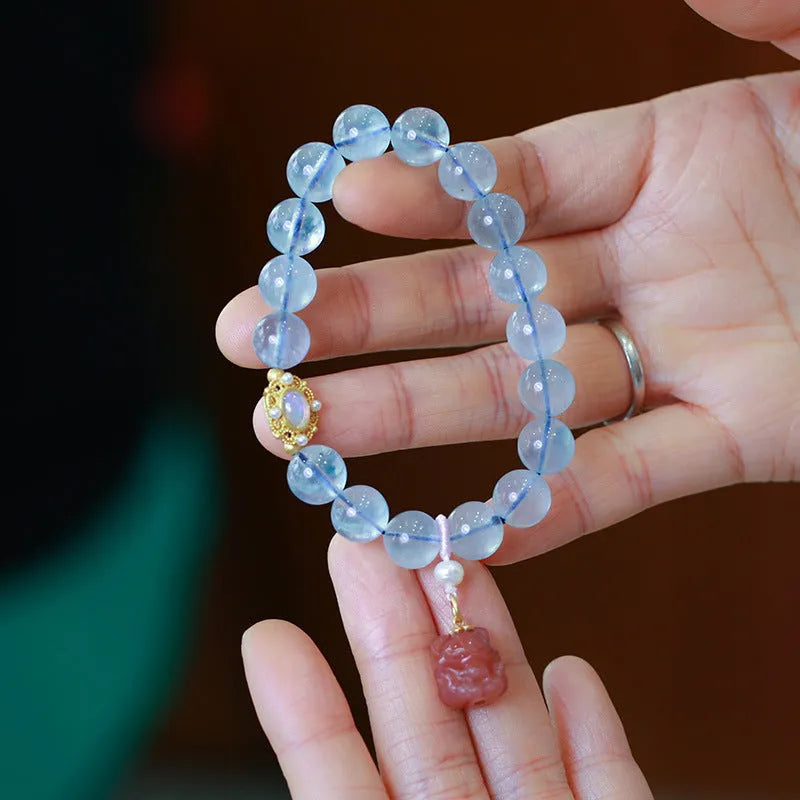 Aquamarine Chinese Fengjiu style bracelet with fox design and pink crystal accents for women