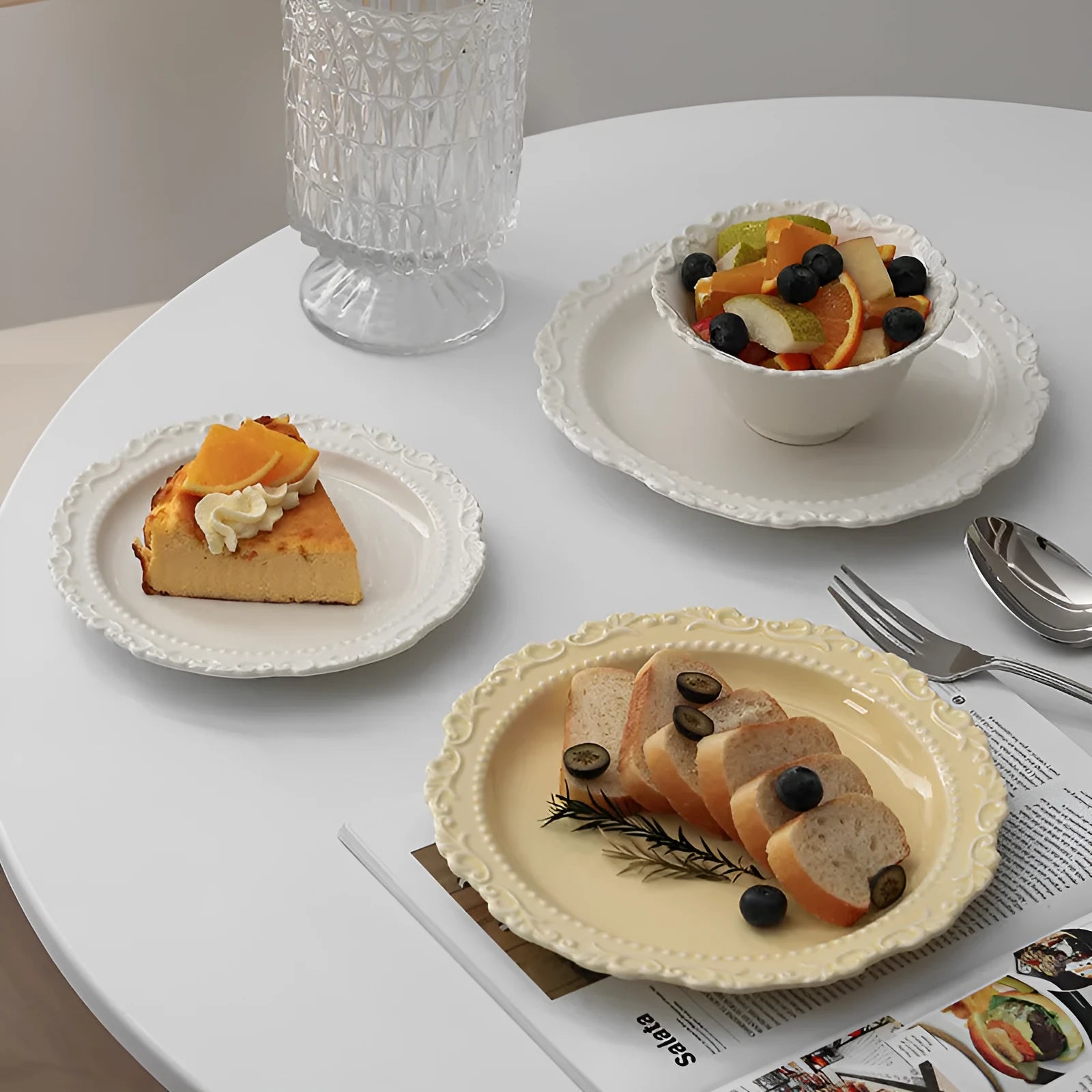 Cream ceramic vintage lace plate with irregular shape and glazed finish in white