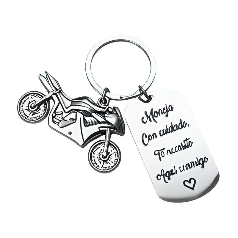 Stainless steel motorcycle keychain with velvet cloth on flannel background