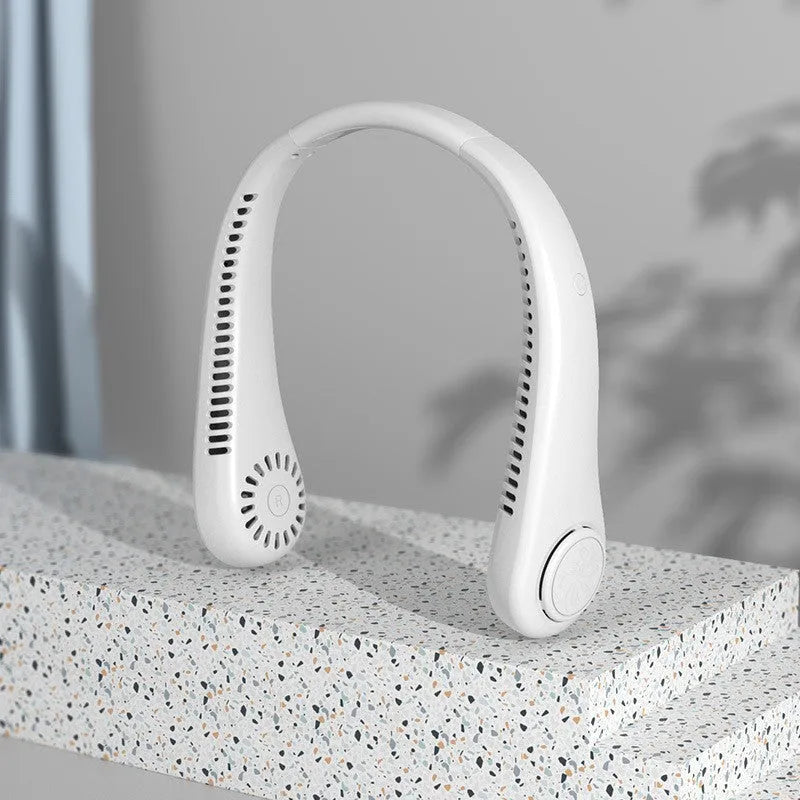 Blue bladeless neck fan hanging around a person's neck, showing the USB charging port and control buttons.