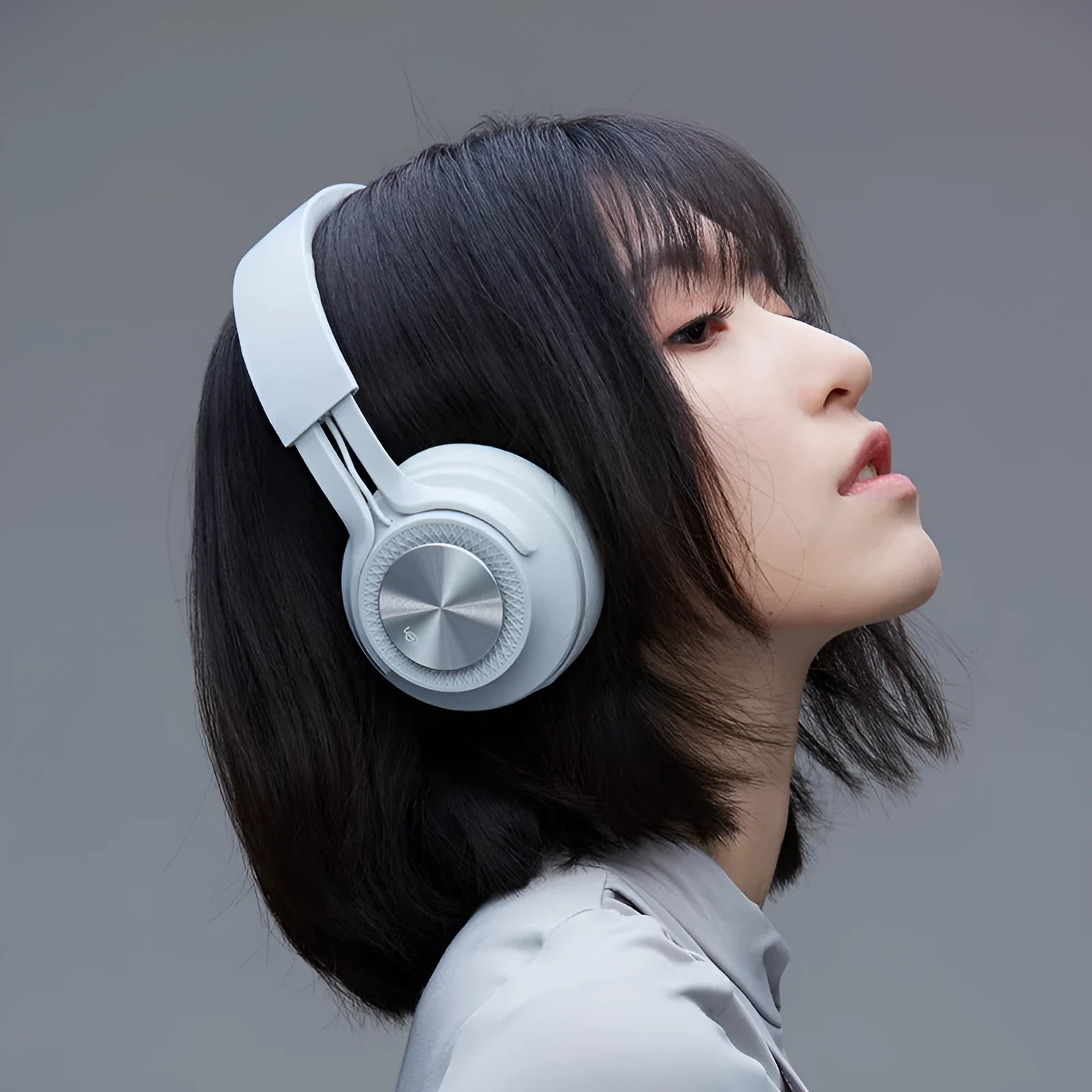 Sports wireless Bluetooth headset in red, grey, green, and black colours.