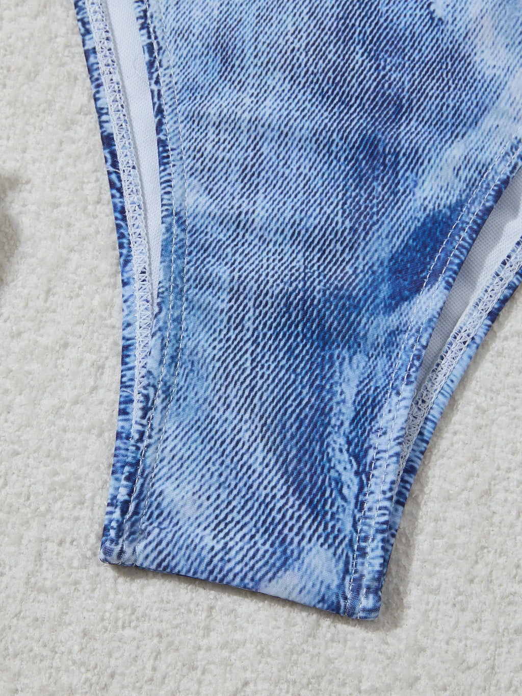 Denim blue printed women's bikini set with adjustable straps on the top.