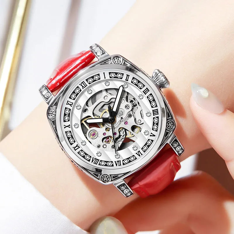 Mechanical watch with leather strap and luminous hands on a dial, shown in multiple colour options.