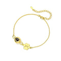 Titanium steel pet paw print cuff bracelet with chain and cat claw elements in gold finish