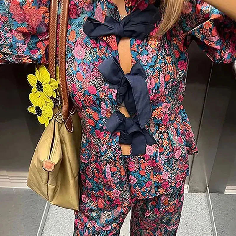 Women's floral printed trousers suit set with tie-neck puff sleeve top and matching trousers