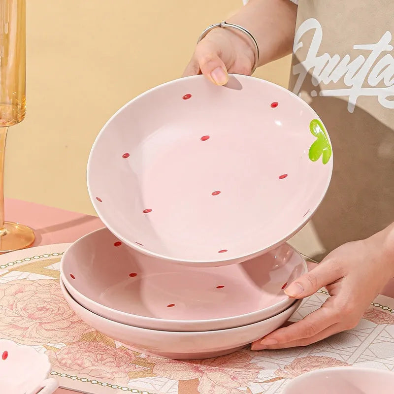 Cute strawberry-themed porcelain dinnerware set with flower bowl, fish dish, plates, and spoon.