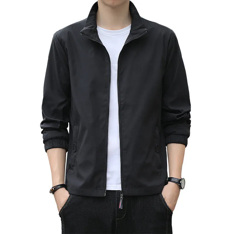 Man wearing a thin, loose lapel Korean-style casual jacket in a neutral colour.