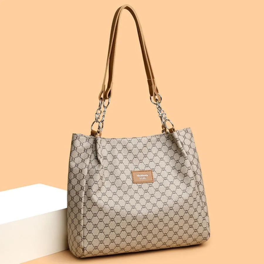 Women's retro fashion handbag in soft brown PU leather with shoulder strap.