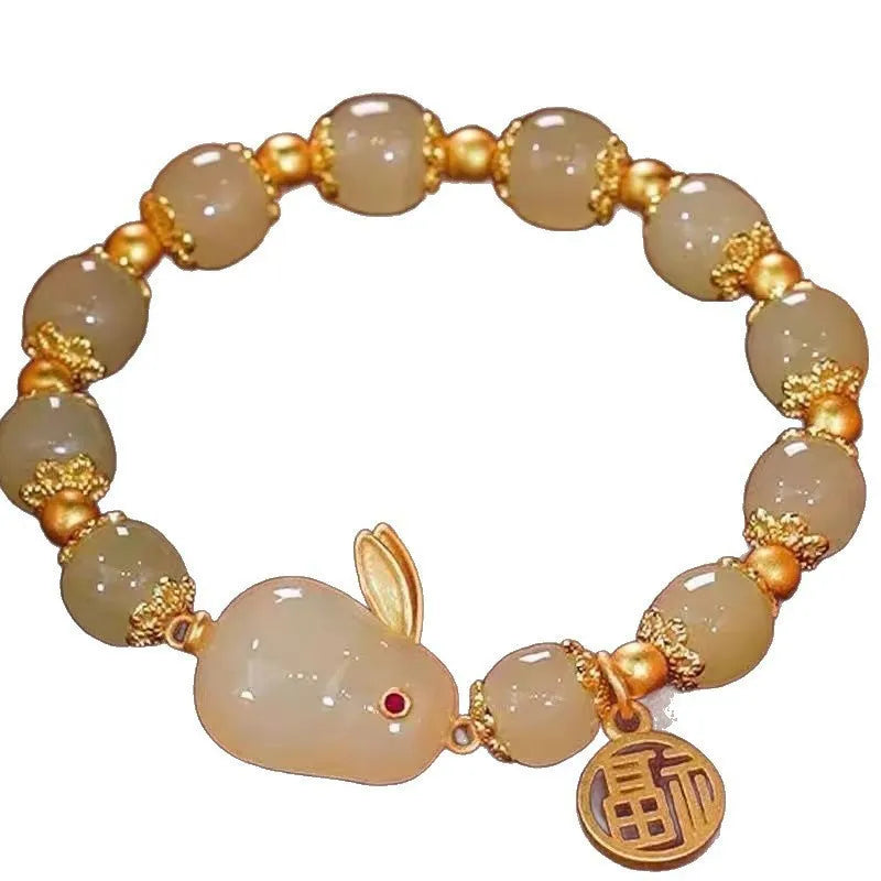 Peace buckle bracelet with a coloured glass rabbit charm on a simple band