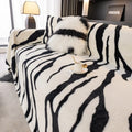 Zebra pattern flannel sofa cover in caramel colour, laid flat showing its size and non-slip textured fabric.