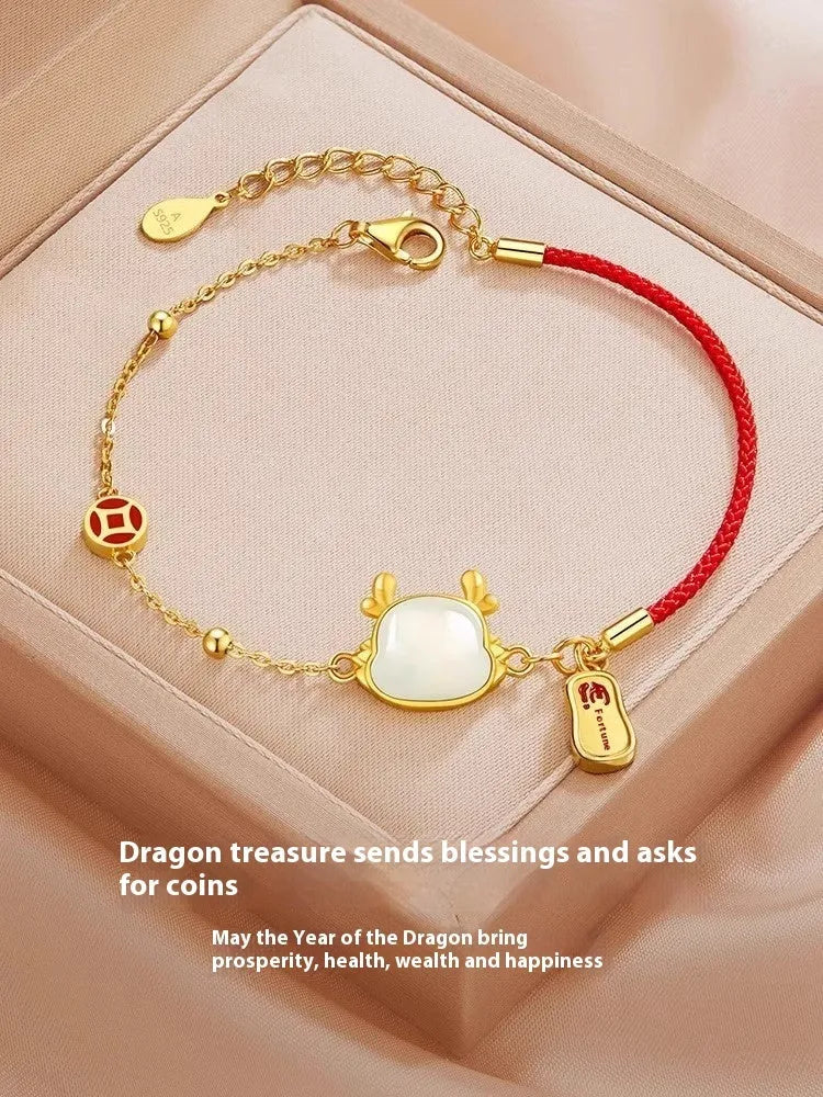 Silver plated dragon zodiac bracelet with Hetian jade detailing on wrist