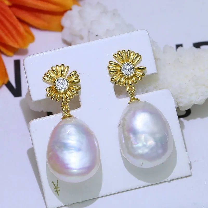 S925 sterling silver baroque flower earrings on a silver ring holder, showing gold and silver colour frame options.