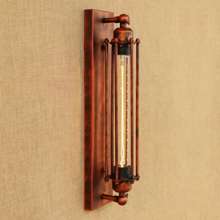 Industrial retro iron wall lamp in a vertical flute design, shown in a choice of metallic finishes.