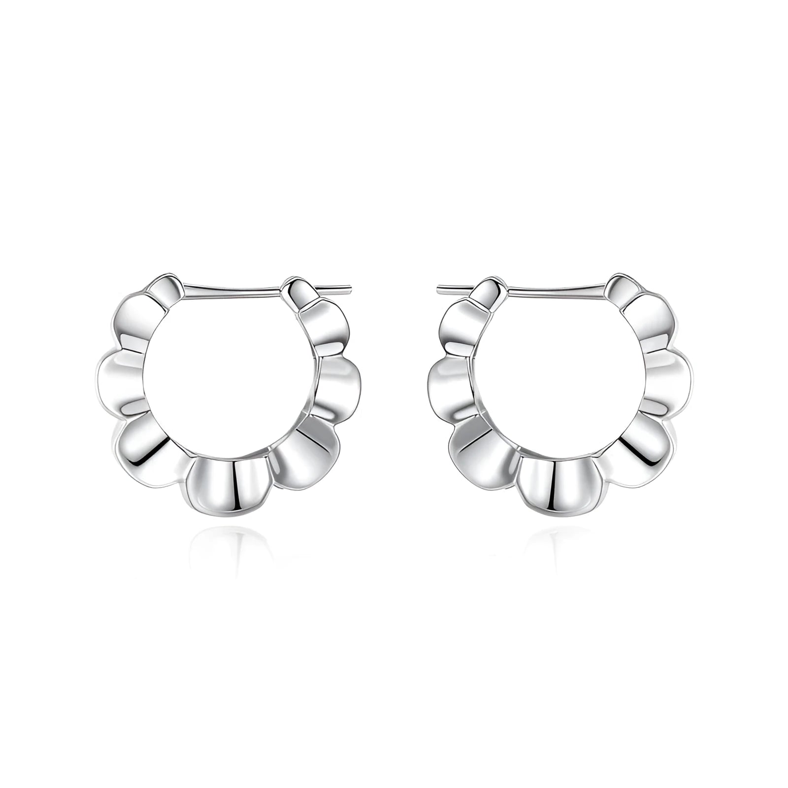A pair of sterling silver geometric earrings with a round retro design.