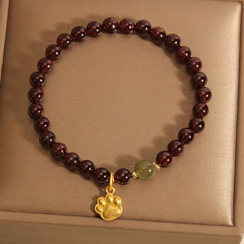 Women's Cat's Paw garnet style crystal bracelet on packaging