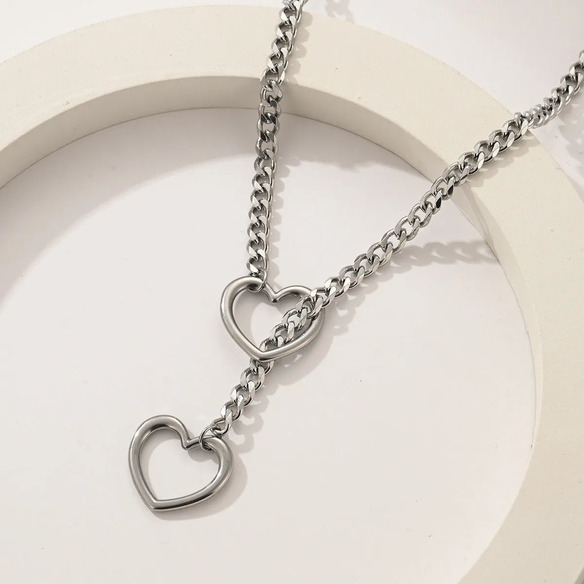 Stainless steel lariat heart necklace with long regular chain in steel, gun black, or gold