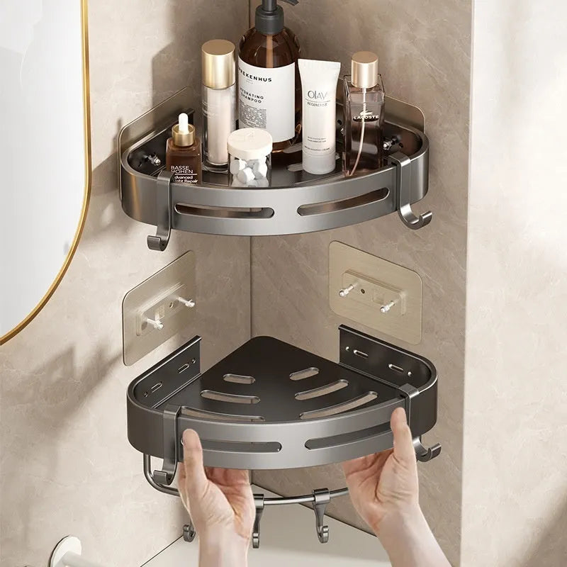 Gun grey triangle bathroom storage rack mounted in corner with towels and toiletries