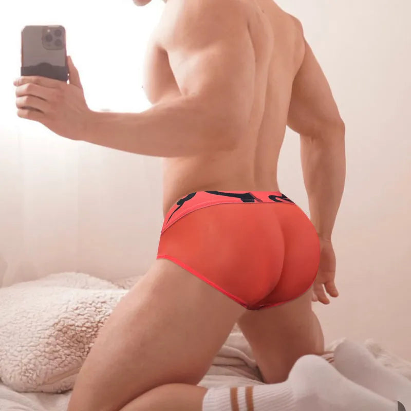 Men's solid colour modal mesh low-waist boxer shorts in black, pink, and red for sports
