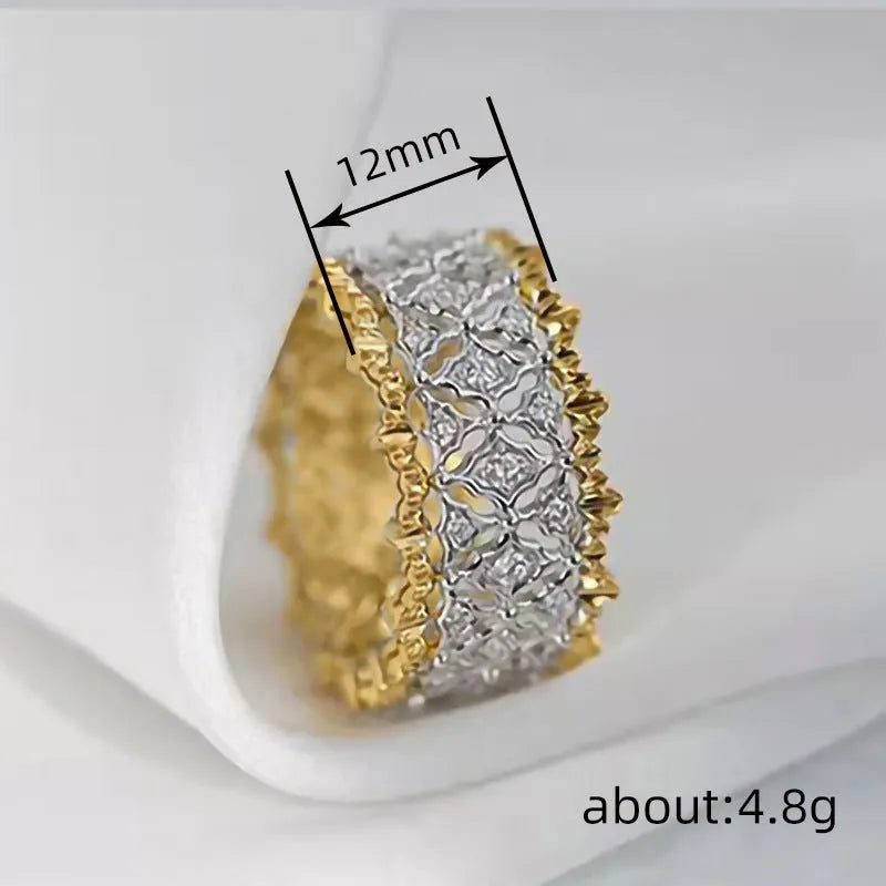 Geometric round two-tone zircon ring on a copper band, showing electroplated finish.