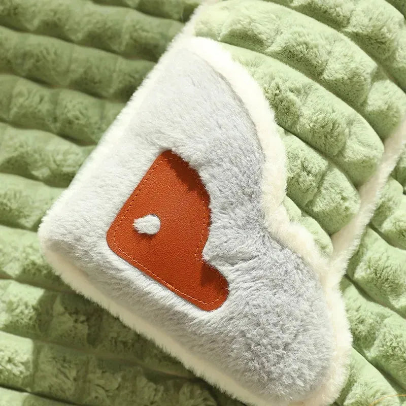 Large rectangular dog bed mat with a removable cover in a grey colour on a wooden floor.