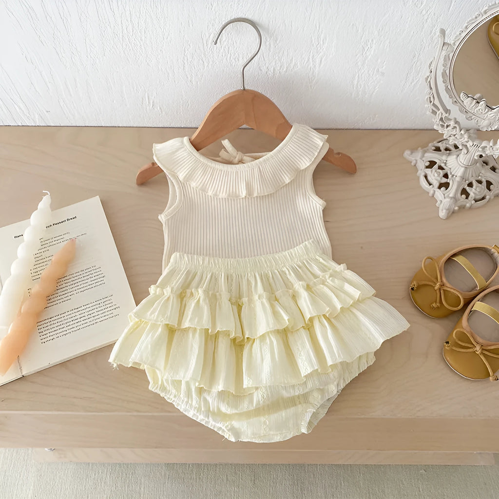 Beige cotton girls summer set with sleeveless ruffled collar top and double-layer bud-waisted shorts