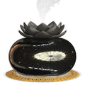 Pure black lotus-shaped USB aromatherapy humidifier with ceramic bowl on a table