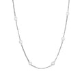 Pearl necklace with copper geometric pendant and ball bead chain on dark background
