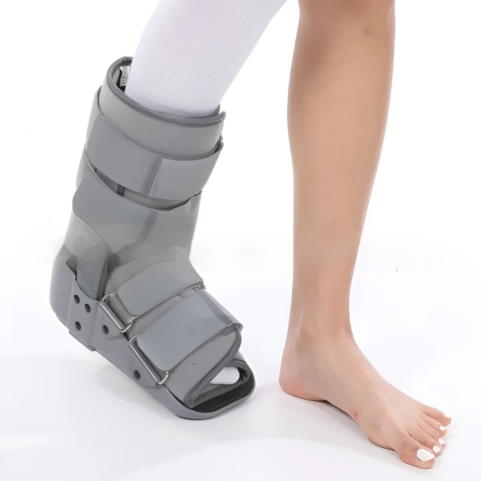 Grey and black Achilles tendon rehabilitation boot with adjustable straps and a rigid plastic shell