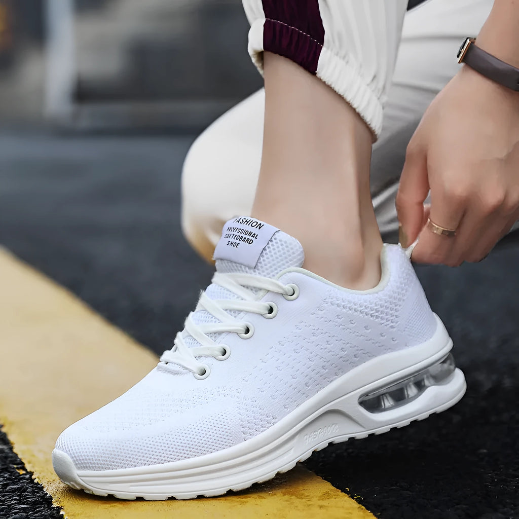 Casual Flyknit running shoes in a colour option, showing mesh upper and round toe design.