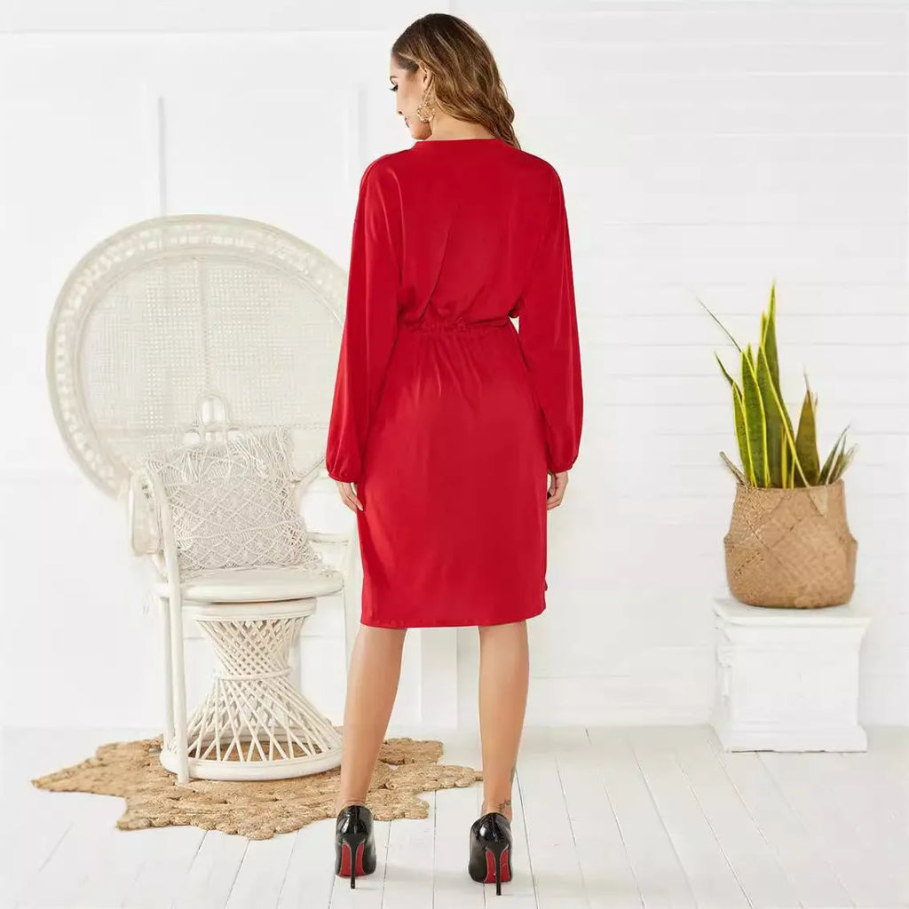 A black polyester cardigan dress with long sleeves, an elastic waist, and a removable cinch belt on a midi A-line skirt.