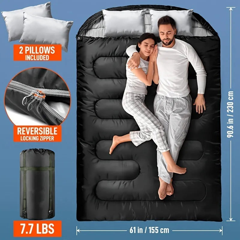 Portable pillow size polyester sleeping bag in black double colour, folded compact