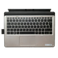 Wireless Bluetooth keyboard acting as a base for an HP Elite X2 tablet, showing multimedia keys.