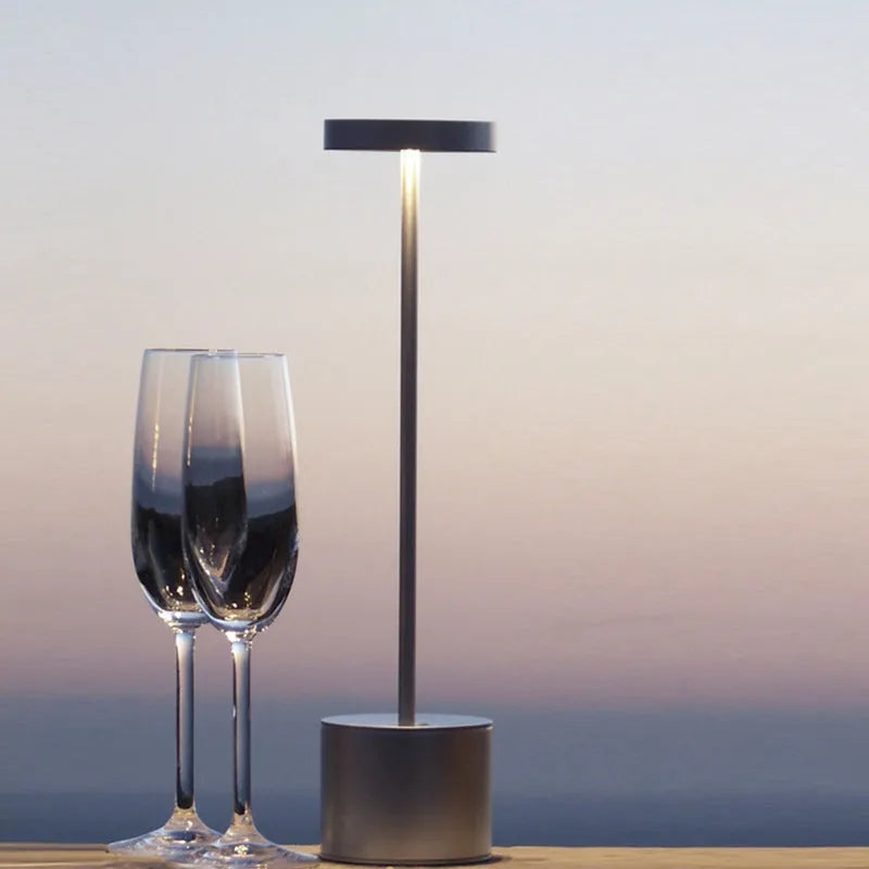 Aluminium rechargeable touch desk lamp in silver finish showing dimmable LED light.
